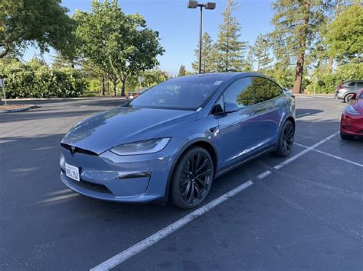 Addison Rae's dad gets her Tesla Model X wrapped in bright pink