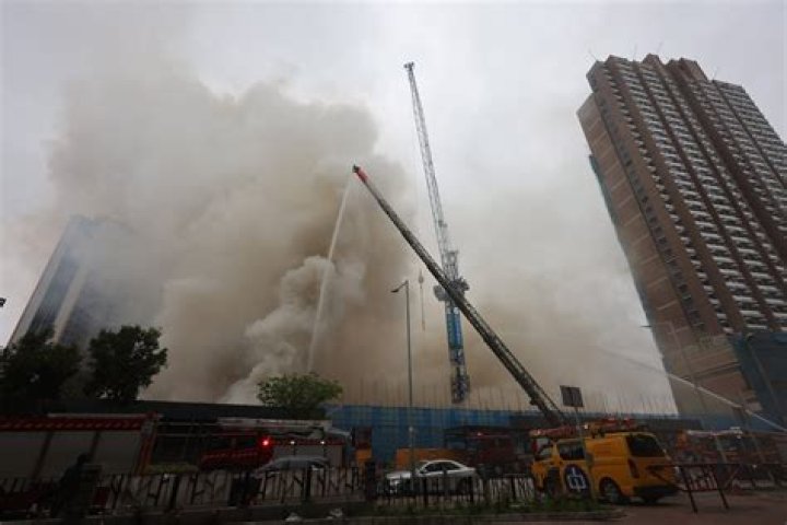 Blaze at Hong Kong construction site upgraded; 2 tower cranes at risk of collapsing