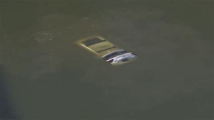Teen jumps into cold lake to try and rescue driver